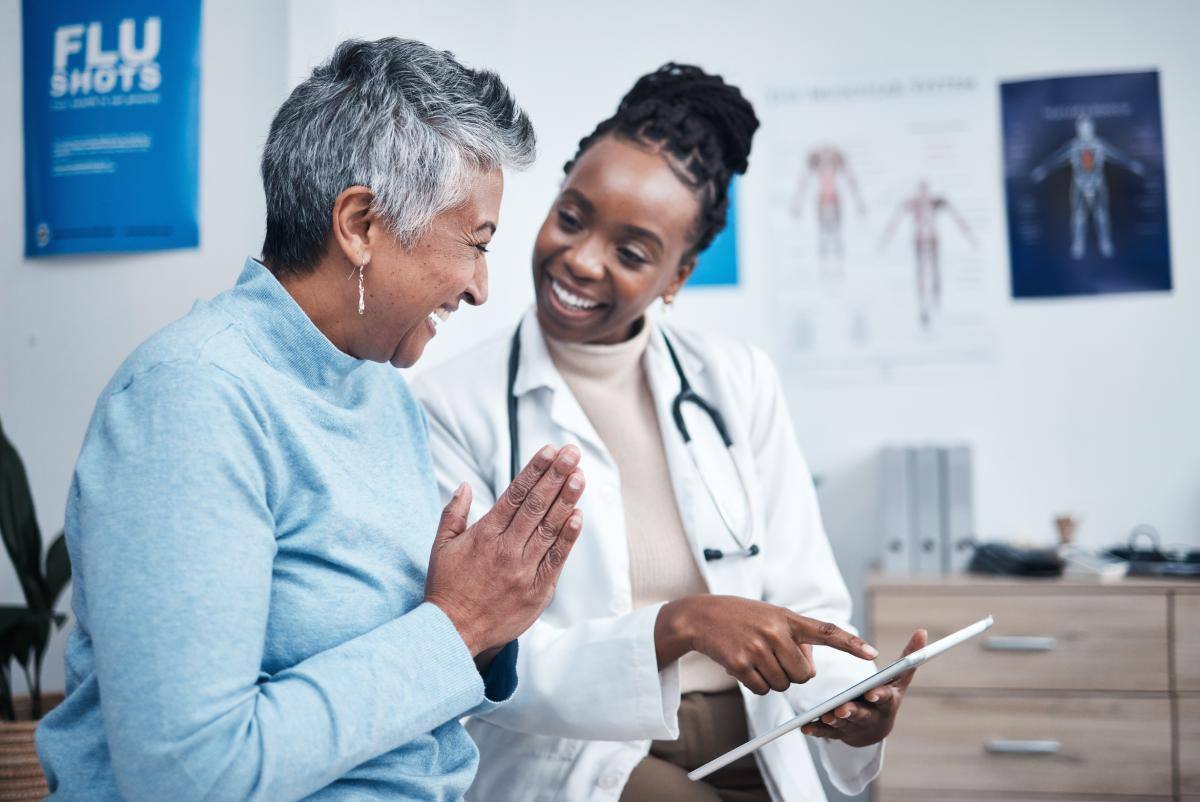 An older woman meeting her doctor