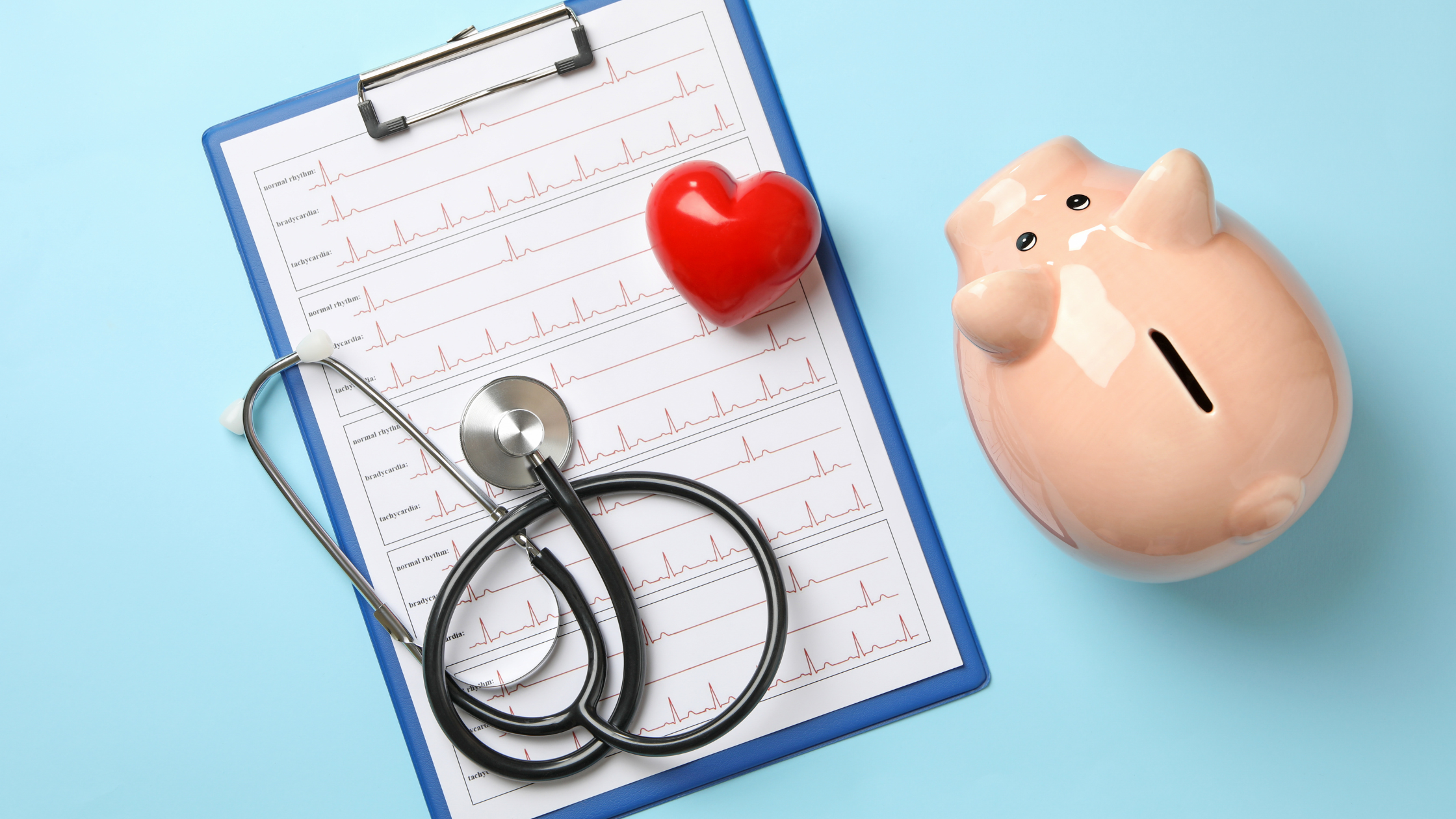 clipboard, heart, stethoscope and a piggy bank