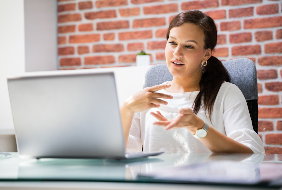 woman video chatting on laptop